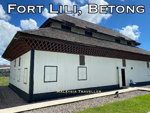 white walled timber fort with shingle roof