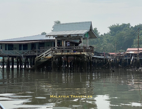 boys fishing from a jetty