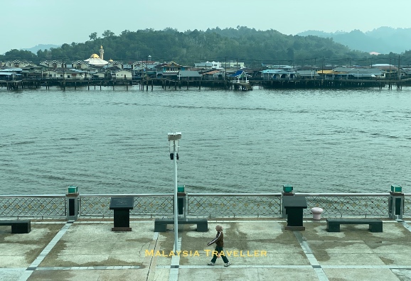 view of Brunei River with Kampong Ayer behind view of Brunei River with Kampong Ayer behind