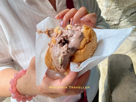 chocolate ice cream in a sesame seed bun