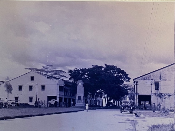 memorial clock tower on quiet street