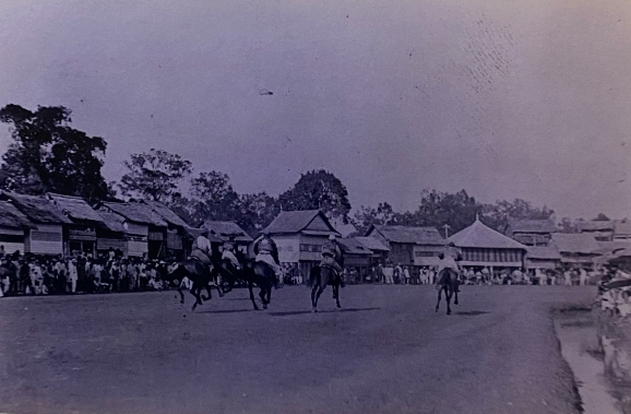 spectators watching a horse race
