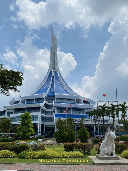 conical building with blue roof