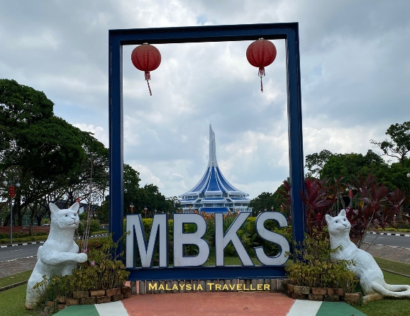frame with the letters MBKS flanked by cat statues