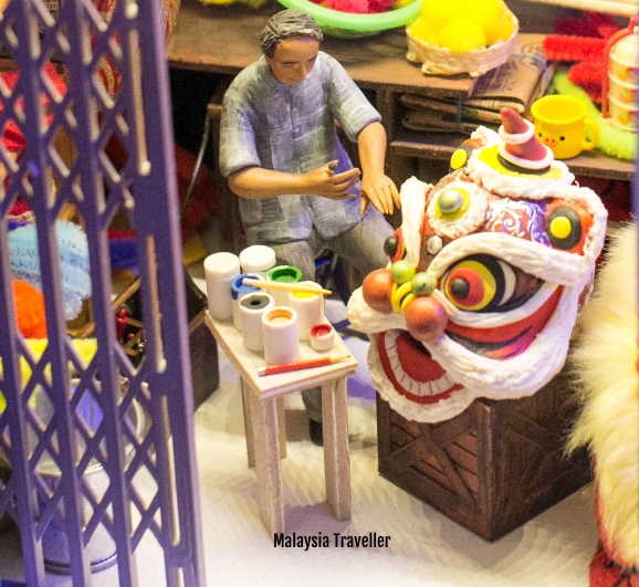 MinNature Malaysia model of man decorating lion dance head