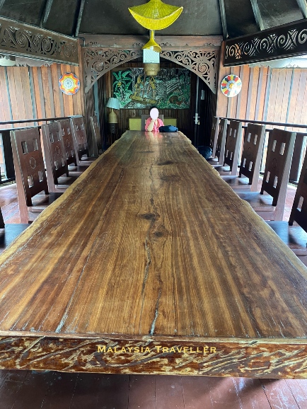 long dining table made from one piece of tropical hardwood