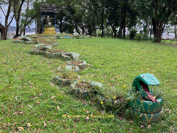 car tyres painted to resemble a snake
