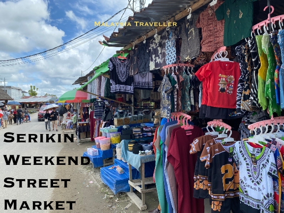 market stall selling t-shirts and dresses