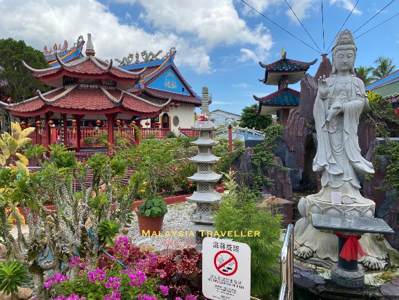 garden with chinese pavilion and guanyin statue