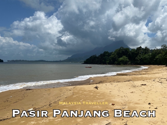 sandy tropical beach with mount santubong in the background