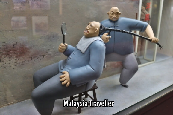 model showing cutting off the mandatory queue hairstyle as a symbol of rebellion against the Manchu model showing cutting off the mandatory queue hairstyle as a symbol of rebellion against the Manchu