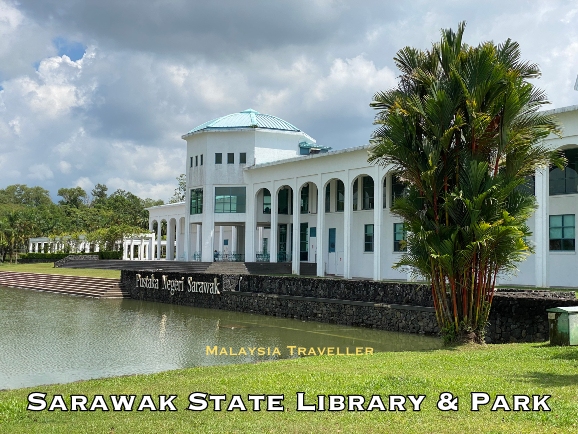 white library building overlooking the lake