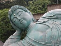reclining buddha in bronze
